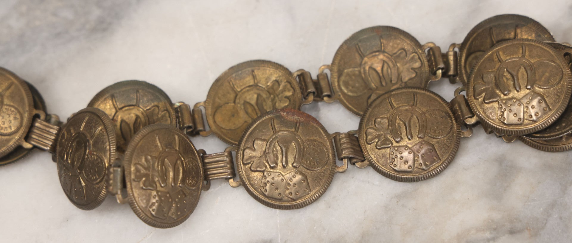 Lot 048 - Vintage Pressed Brass Good Luck Charm Necklace With Four Leaf Clover, Lucky Penny, Dice, Horseshoe, And Wishbone, With Fifteen Pressed "Coins"