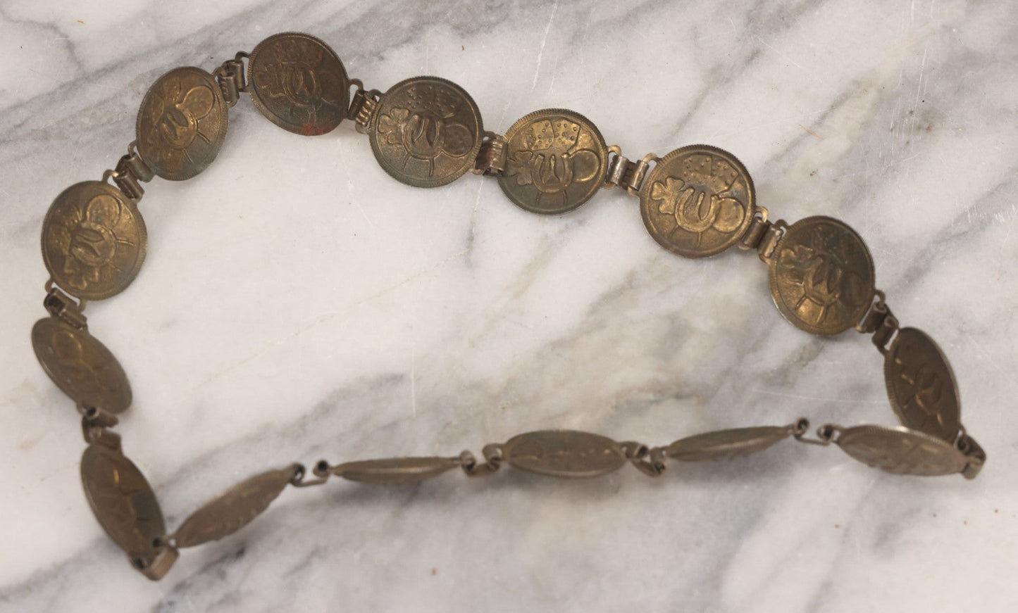 Lot 048 - Vintage Pressed Brass Good Luck Charm Necklace With Four Leaf Clover, Lucky Penny, Dice, Horseshoe, And Wishbone, With Fifteen Pressed "Coins"