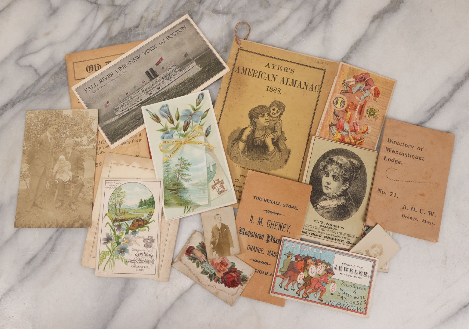 Lot 054 - Grouping Of Sixteen Assorted Antique Ephemera Pieces Including Lithographed Trade Cards, Envelope From The Rexall Store, Fall River Line Steamship Envelope, And Ayer's American Almanac For 1888