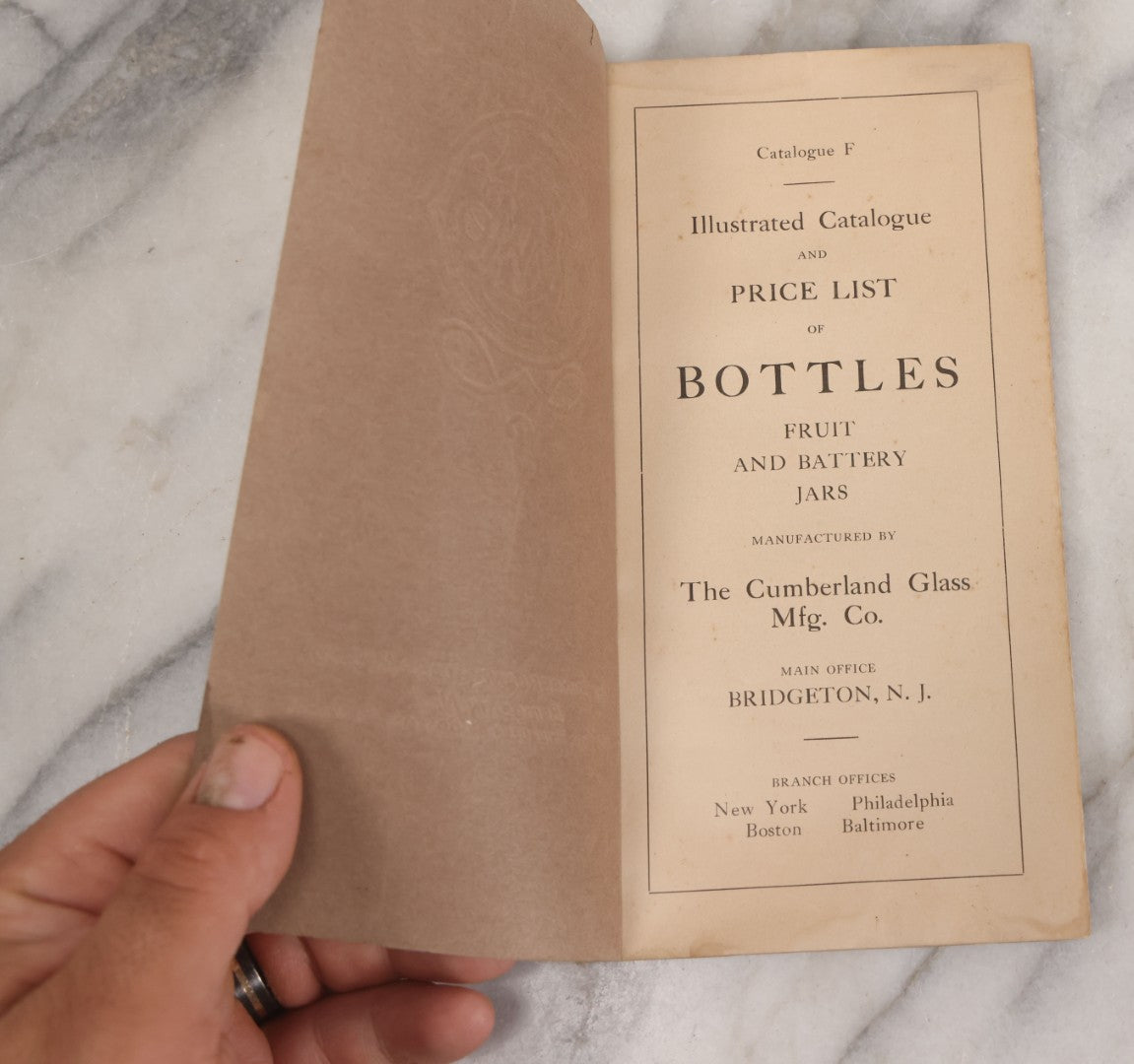 Lot 055 - Antique "Illustrated Catalogue And Price List Of Bottles, Fruit And Battery Jars", Manufactured By The Cumberland Glass Manufacturing Co., Bridgeton, New Jersey, Catalogue F. With Embossed Cover And Many Images Of Bottles, Circa 1920