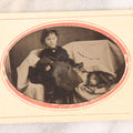 Lot 063 - Antique Tintype Photograph Of Little Girl Posing With Large Doll And Scraggly Little Dog, Photo In Landscape Orientation, In Paper Frame