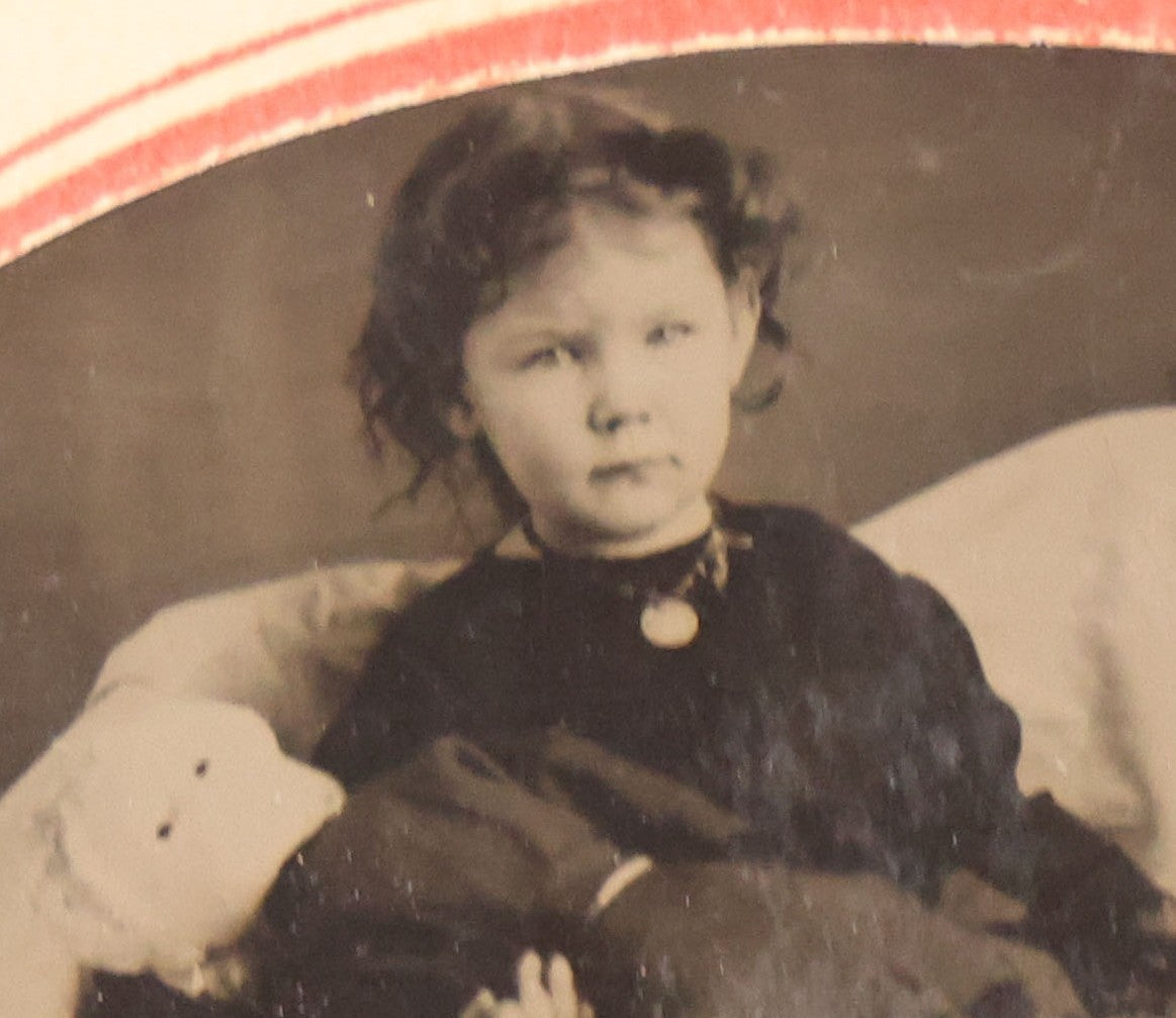 Lot 063 - Antique Tintype Photograph Of Little Girl Posing With Large Doll And Scraggly Little Dog, Photo In Landscape Orientation, In Paper Frame
