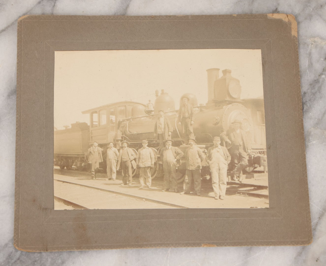 Lot 066 - Six Piece Railroad Photography And Ephemera Grouping Including Five Boarded Photographs Of Locomotives, Trains, And Railroad Workers, And Delivery Receipt From Old Colony Railroad Company, Leominster, Massachusetts