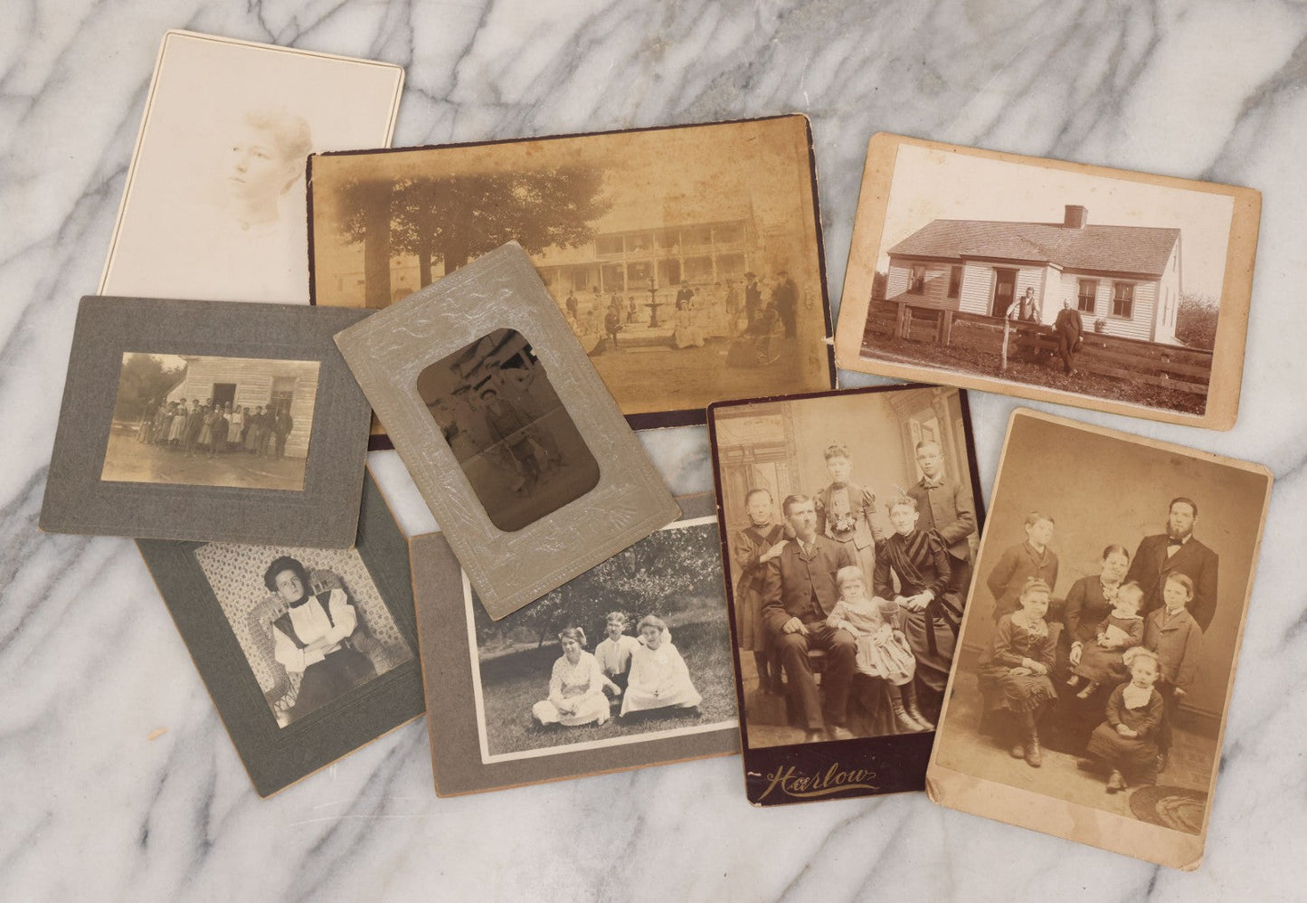 Lot 068 - Grouping Of Nine Antique Photographs Including Souvenir Tintype Of Young Boys In Overalls, Group Photo Of Family Posing Outside Large Farmhouse, Cabinet Cards, And More