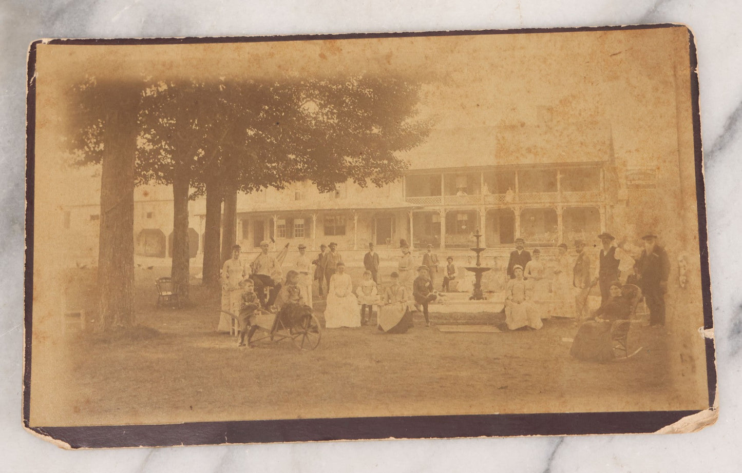 Lot 068 - Grouping Of Nine Antique Photographs Including Souvenir Tintype Of Young Boys In Overalls, Group Photo Of Family Posing Outside Large Farmhouse, Cabinet Cards, And More