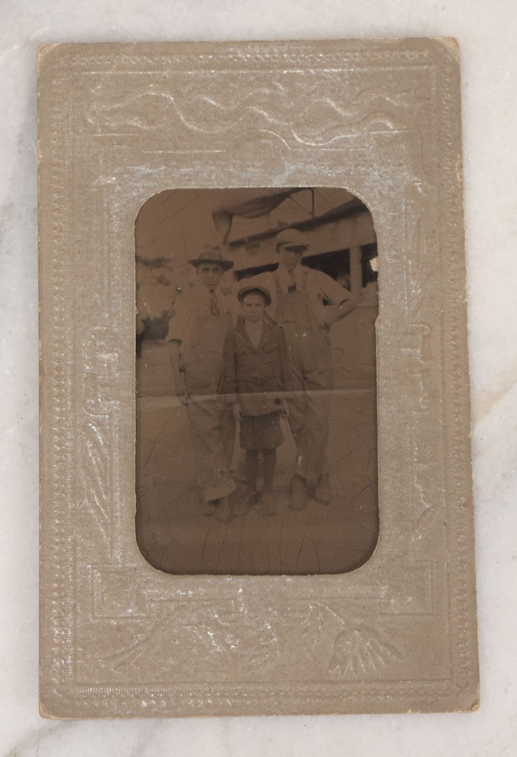 Lot 068 - Grouping Of Nine Antique Photographs Including Souvenir Tintype Of Young Boys In Overalls, Group Photo Of Family Posing Outside Large Farmhouse, Cabinet Cards, And More