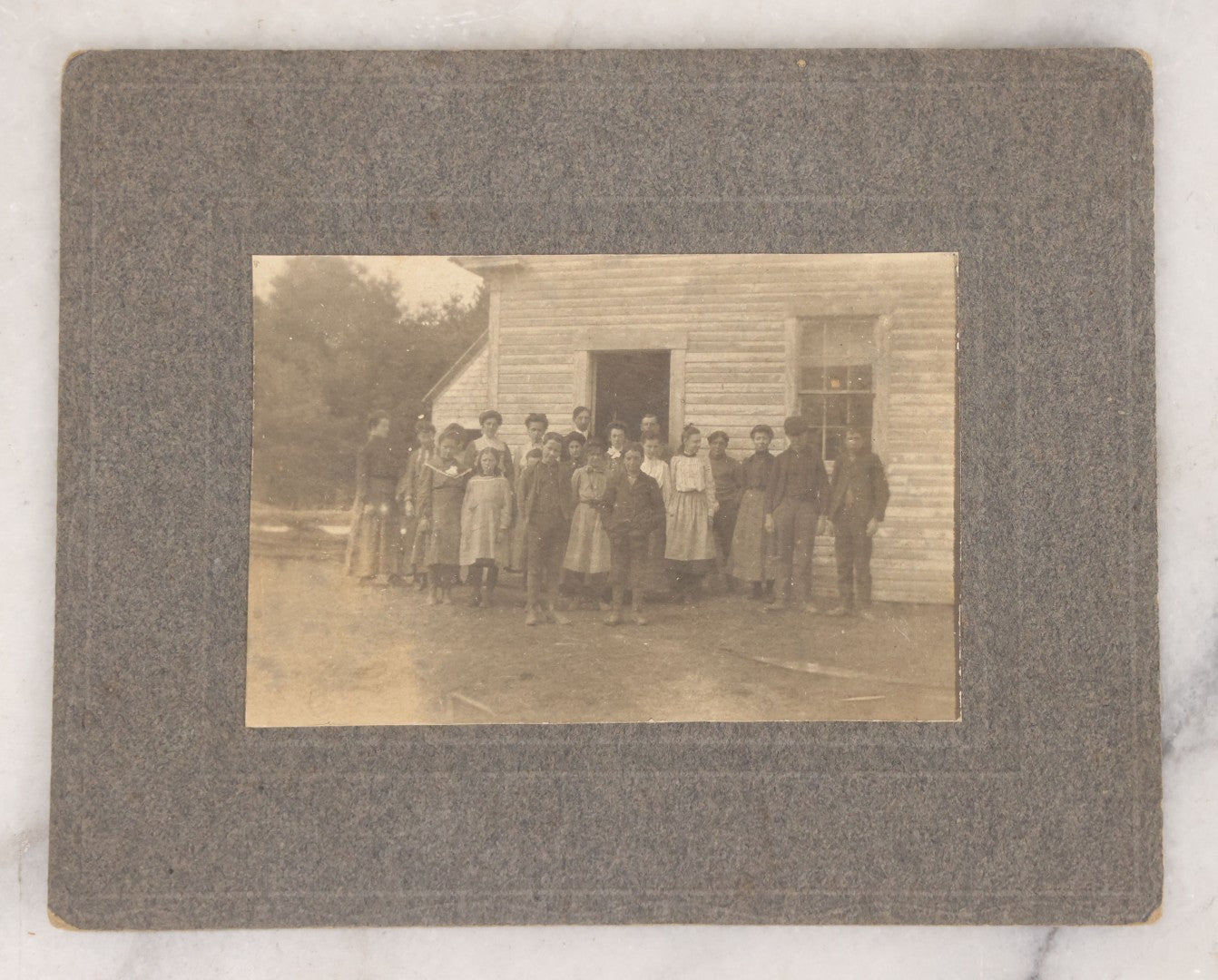 Lot 068 - Grouping Of Nine Antique Photographs Including Souvenir Tintype Of Young Boys In Overalls, Group Photo Of Family Posing Outside Large Farmhouse, Cabinet Cards, And More