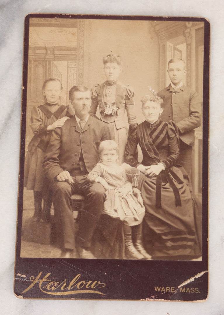 Lot 068 - Grouping Of Nine Antique Photographs Including Souvenir Tintype Of Young Boys In Overalls, Group Photo Of Family Posing Outside Large Farmhouse, Cabinet Cards, And More