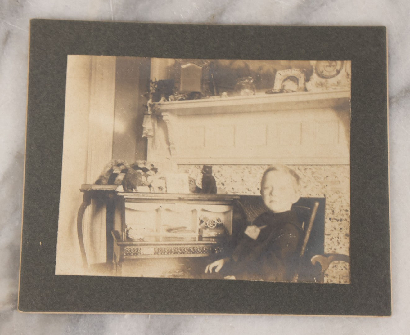 Lot 070 - Grouping Of Seven Antique Photographs Of Children, Including Makeshift Frame Of Girl In Four Views, Children Posing On New York City Stoop, Children In Cribs, Boy Posing With Toys