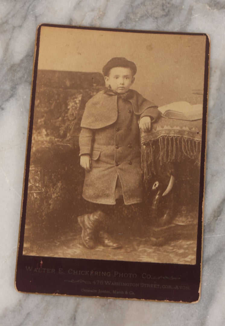 Lot 070 - Grouping Of Seven Antique Photographs Of Children, Including Makeshift Frame Of Girl In Four Views, Children Posing On New York City Stoop, Children In Cribs, Boy Posing With Toys