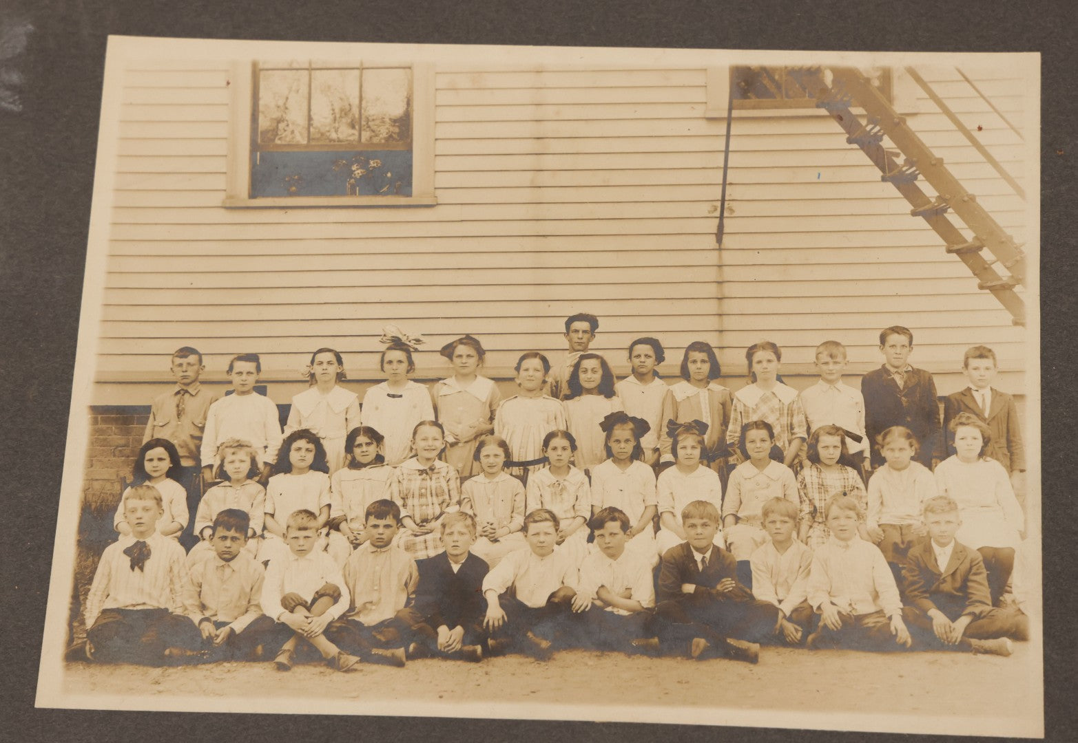 Lot 071 - Grouping Of Four Antique Boarded Photographs Of Class Photos Of Schoolchildren, Including Children Posing With Chicken In Background, Children Posing On School Steps, And Children Posing Beneath Fire Escape