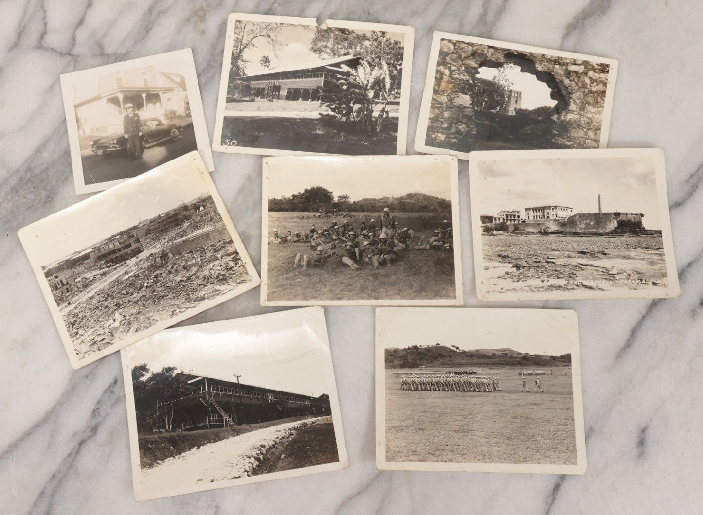Lot 073 - Grouping Of Eight Vintage Snapshot Photographs, Including Photos Of Marching Soldiers, Barracks, Prison Ruins, And Fire Destruction