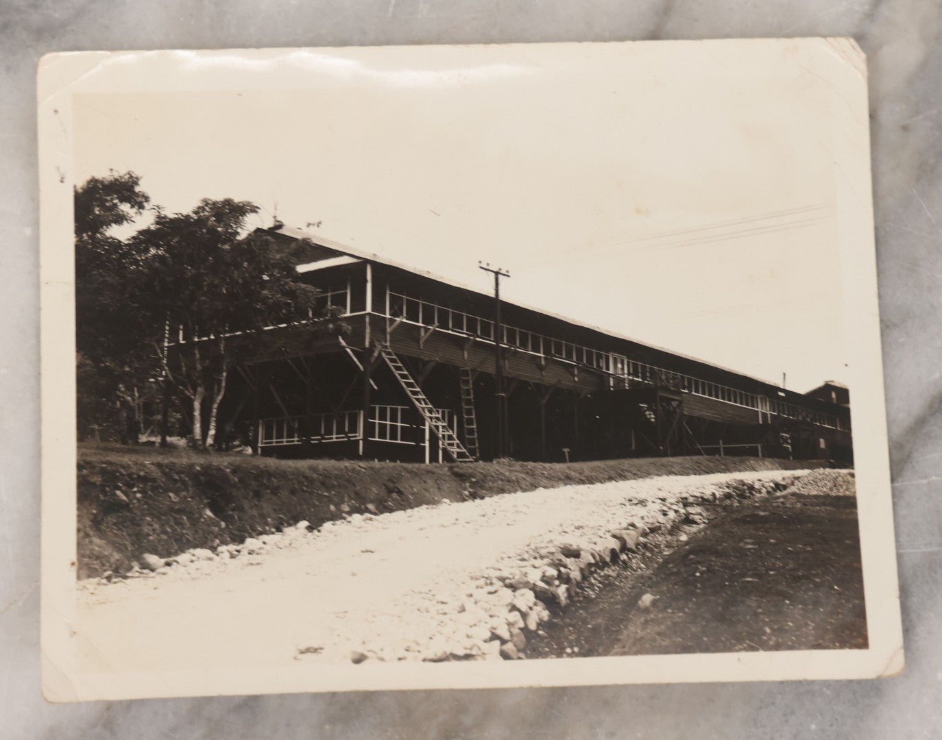 Lot 073 - Grouping Of Eight Vintage Snapshot Photographs, Including Photos Of Marching Soldiers, Barracks, Prison Ruins, And Fire Destruction
