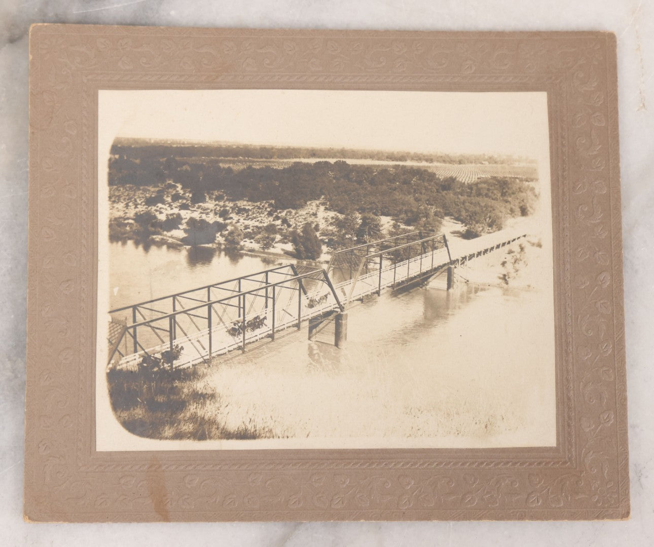 Lot 075 - Grouping Of Four Antique Boarded Photographs Of People And Horses, Including Horse Drawn Cart Crossing Primitive Bridge, Carriages Crossing Suspension Bridge, People On White Horses