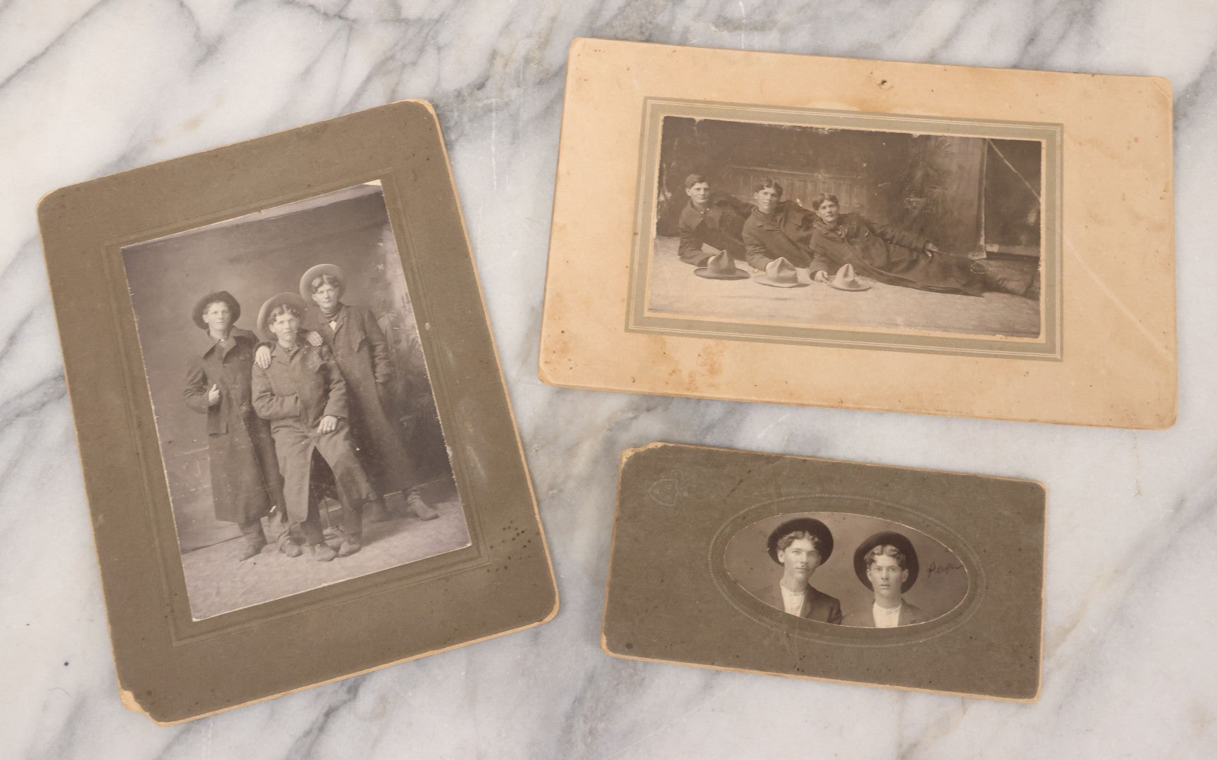 Lot 076 - Grouping Of Three Antique Boarded Photographs Of Young Men In Long Coats And Hats, Including One Labeled "Tough Guys Crew" On Verso