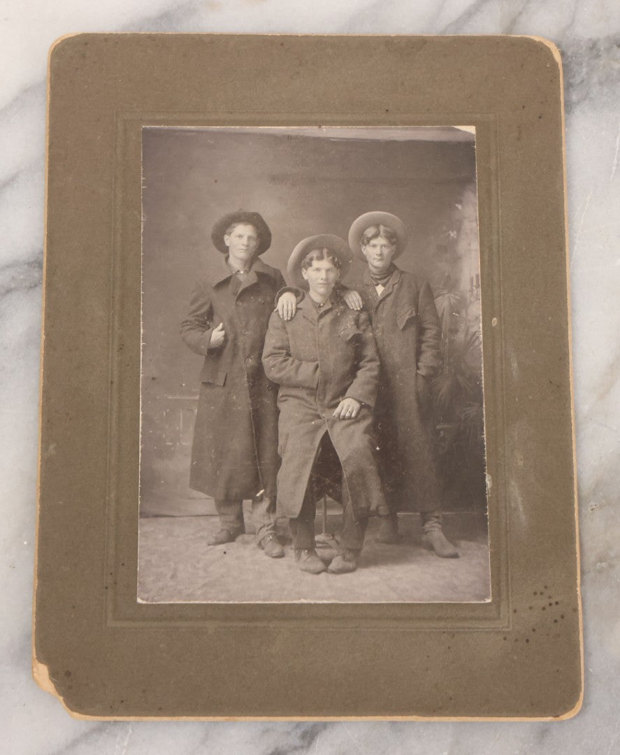 Lot 076 - Grouping Of Three Antique Boarded Photographs Of Young Men In Long Coats And Hats, Including One Labeled "Tough Guys Crew" On Verso