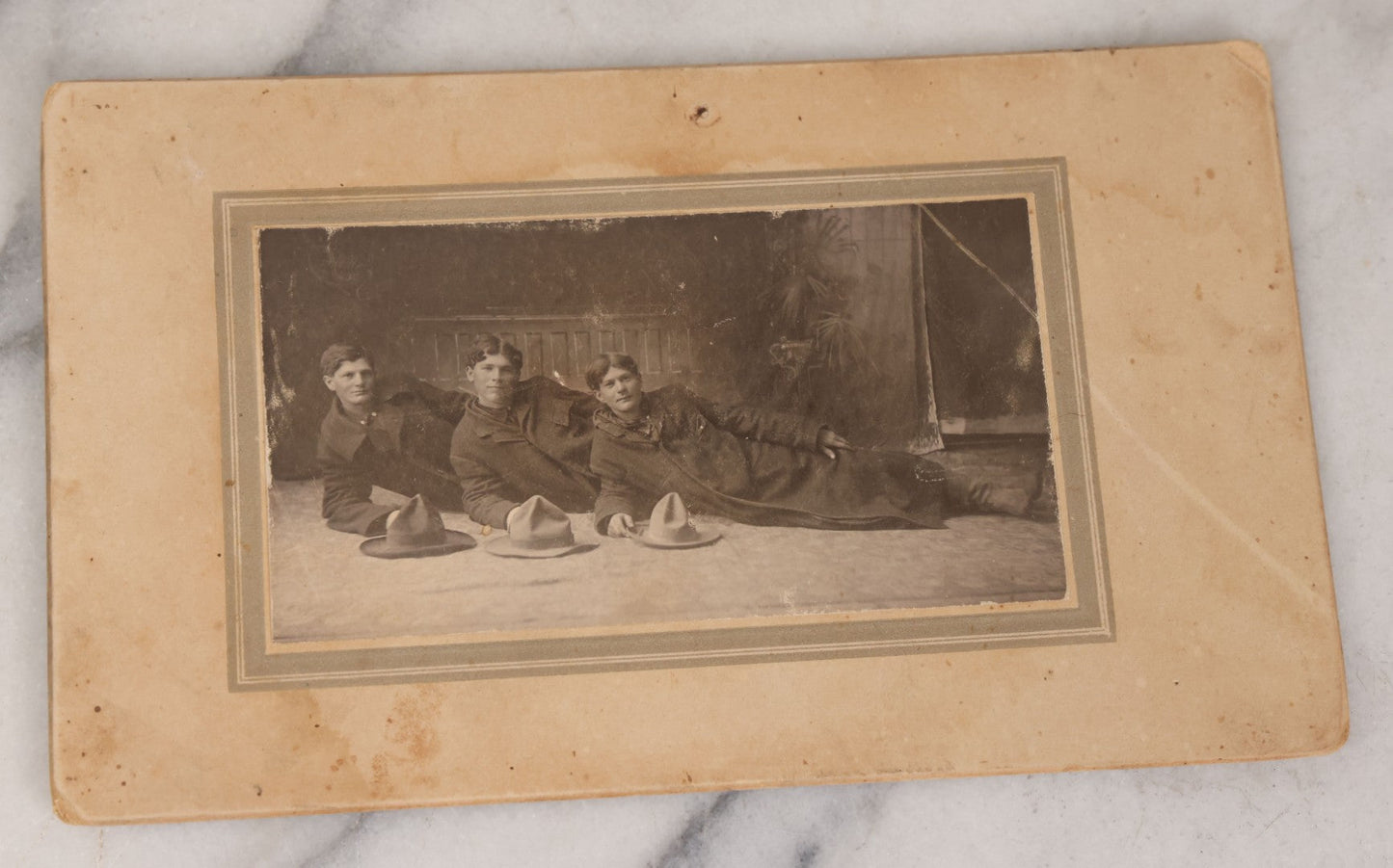 Lot 076 - Grouping Of Three Antique Boarded Photographs Of Young Men In Long Coats And Hats, Including One Labeled "Tough Guys Crew" On Verso
