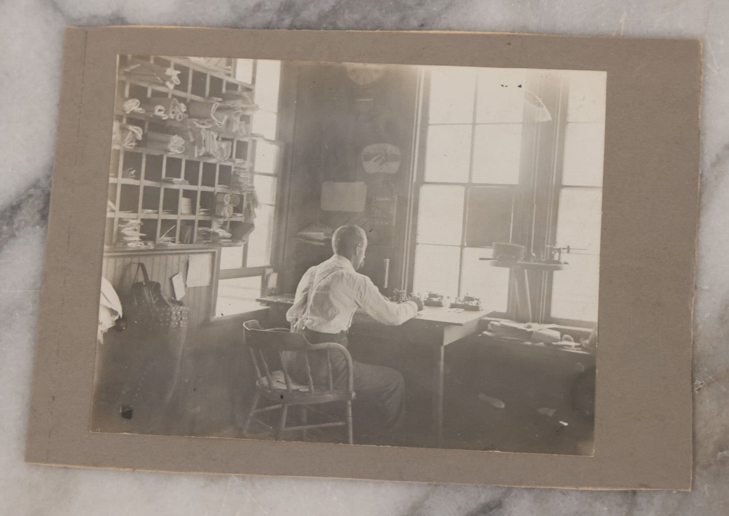 Lot 077 - Grouping Of Five Antique Boarded Occupational Photographs Including Bell Boy, Man At Desk, And Group Of Workers In General Store