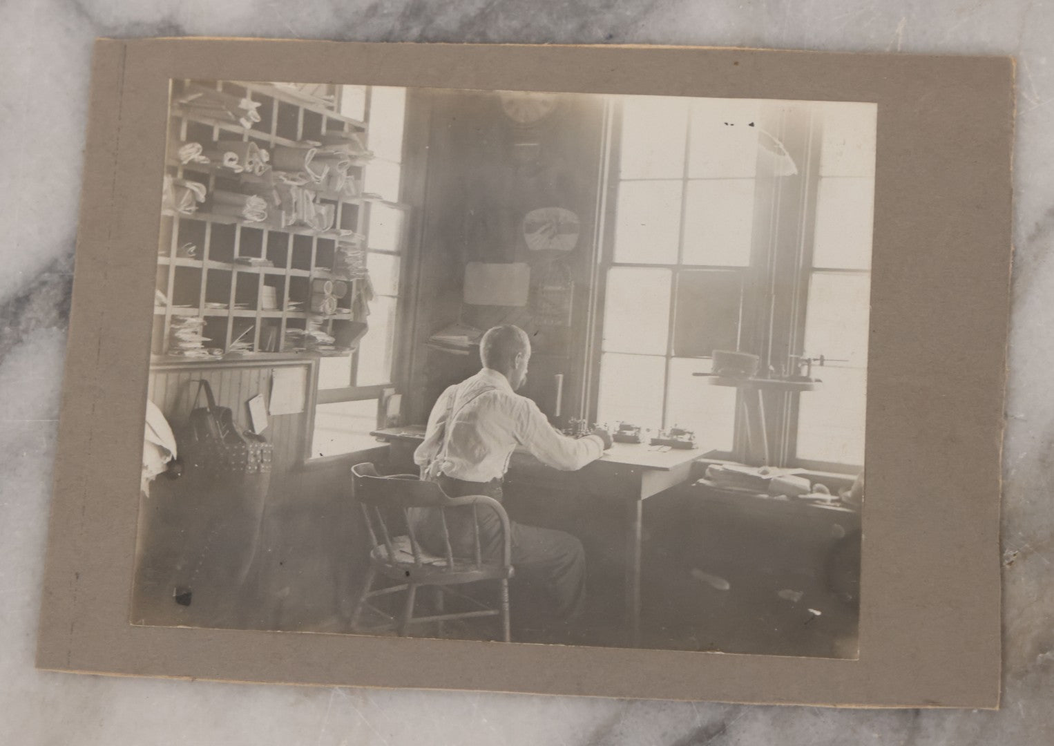 Lot 077 - Grouping Of Five Antique Boarded Occupational Photographs Including Bell Boy, Man At Desk, And Group Of Workers In General Store