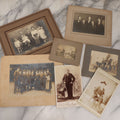 Lot 080 - Grouping Of Seven Antique Boarded Photographs Including Hunters Posing With Shotgun, Business Men In Bowler Hats, And Family Of Six
