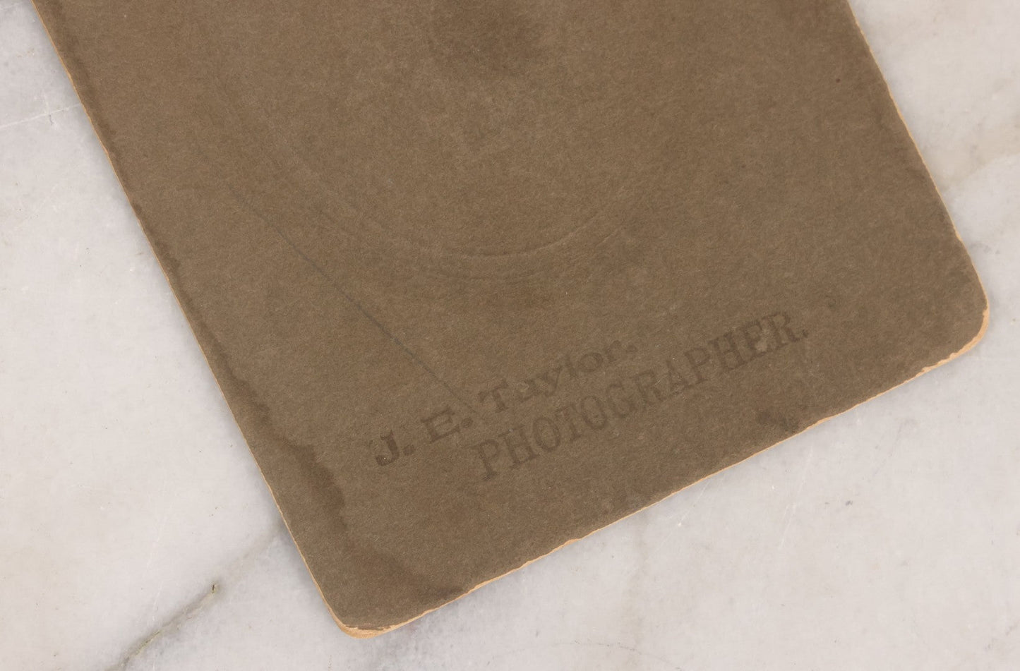Lot 083 - Antique Boarded Photograph Of Two Young Men Enjoying Cigars, One Wearing A Knowing Smirk, J.E. Taylor, Photographer