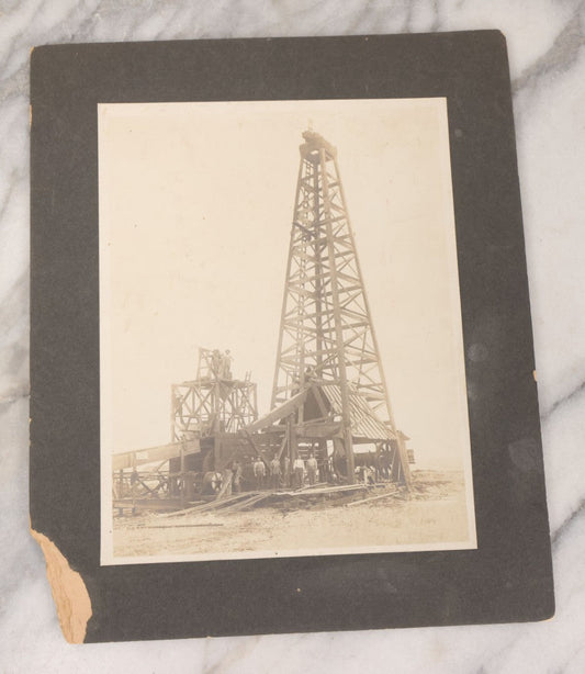Lot 085 - Antique Boarded Occupational Photograph Of Six Men Posing At The Foot Of A Period Oil Well Rig