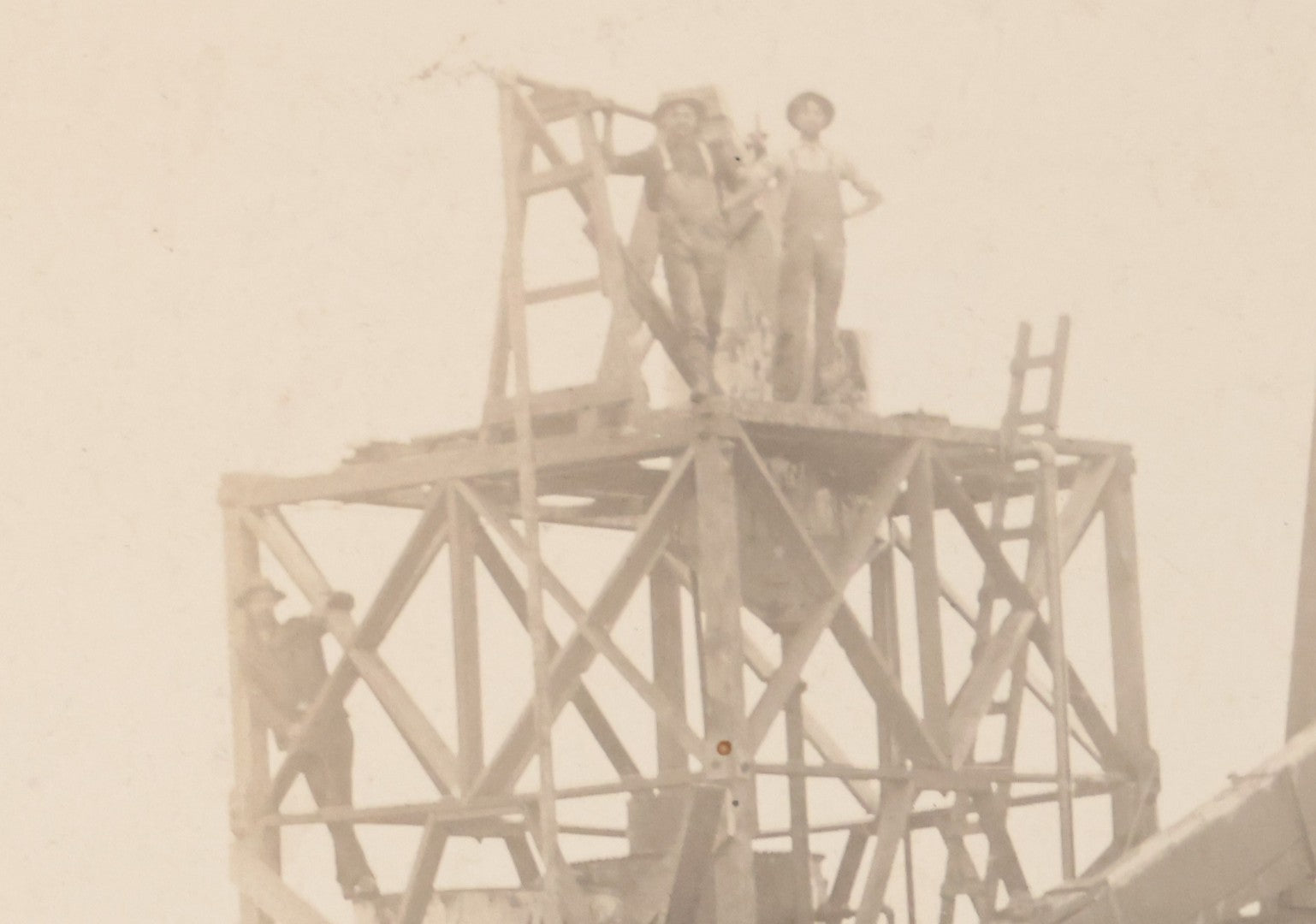 Lot 085 - Antique Boarded Occupational Photograph Of Six Men Posing At The Foot Of A Period Oil Well Rig