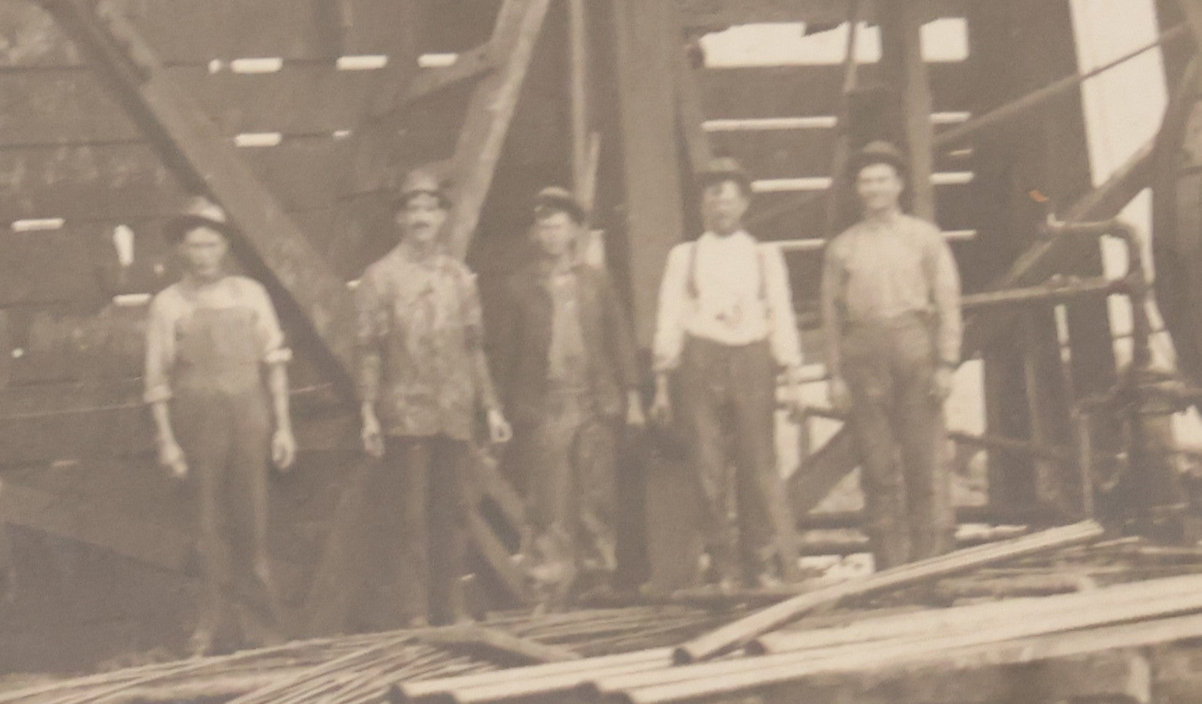 Lot 085 - Antique Boarded Occupational Photograph Of Six Men Posing At The Foot Of A Period Oil Well Rig