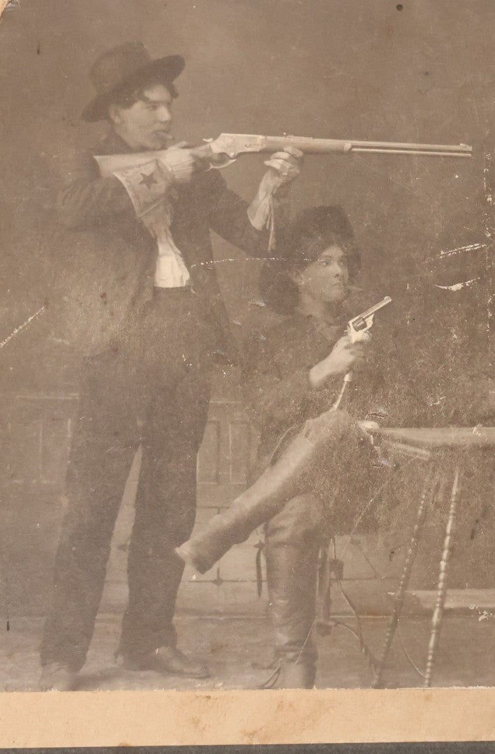 Lot 086 - Antique Boarded Studio Photograph Of Four Boys Drinking, Smoking, And Pointing Guns At Their Buddy