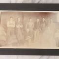 Lot 088 - Antique Boarded Occupational Photograph Of Group Of Workers, Unknown Trade, Posing On A Pile Of Sacks With Bicycles In Background