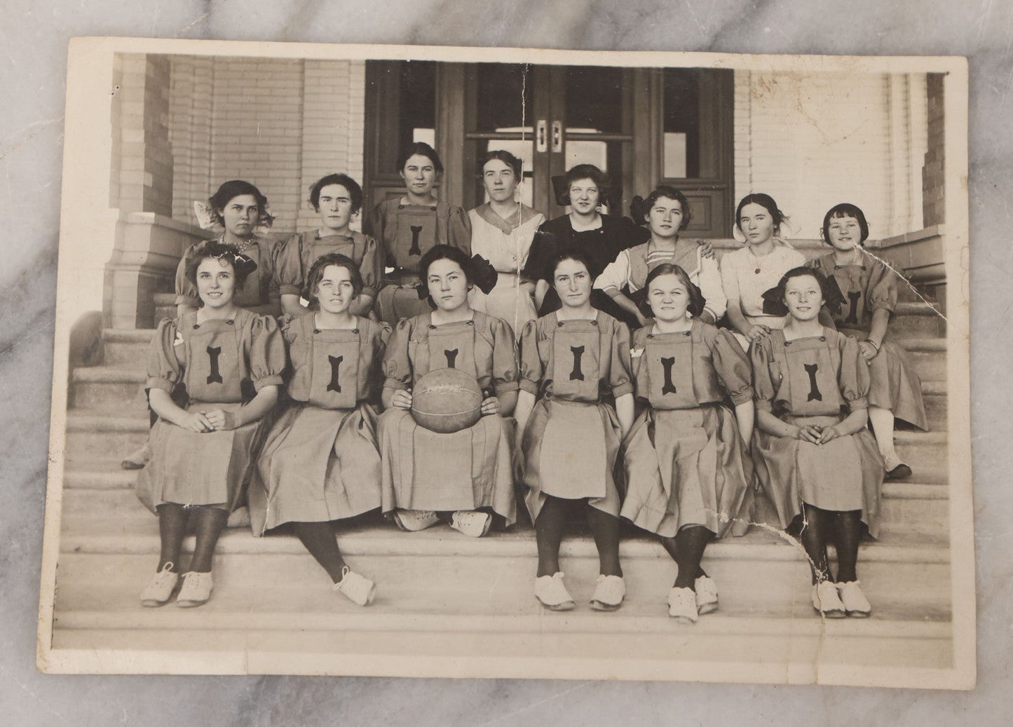 Lot 089 - Antique Unmounted Photograph Of Group Of Young Female Athletes Posing In Handmade Uniforms With Medicine Ball