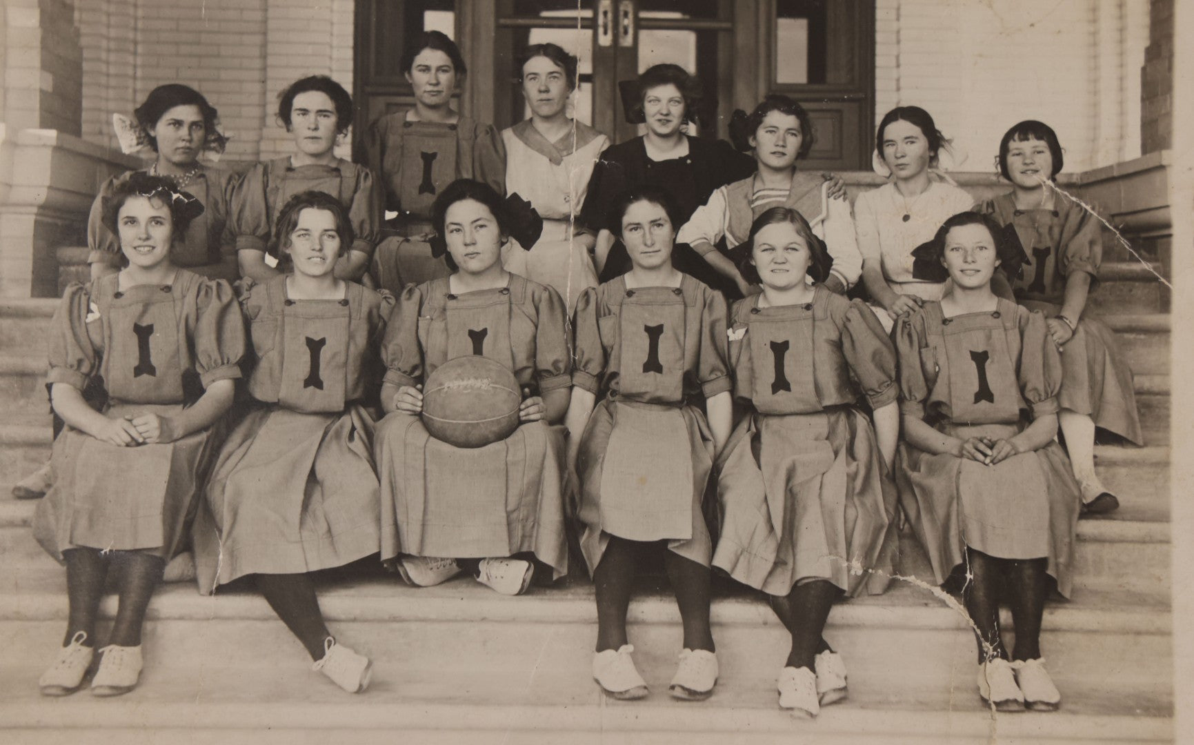 Lot 089 - Antique Unmounted Photograph Of Group Of Young Female Athletes Posing In Handmade Uniforms With Medicine Ball