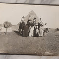 Lot 090 - Antique Unmounted Photograph Of Group Of Tourists On Camels Posing With Tour Guides In Front Of Great Pyramid Of Giza And Sphinx