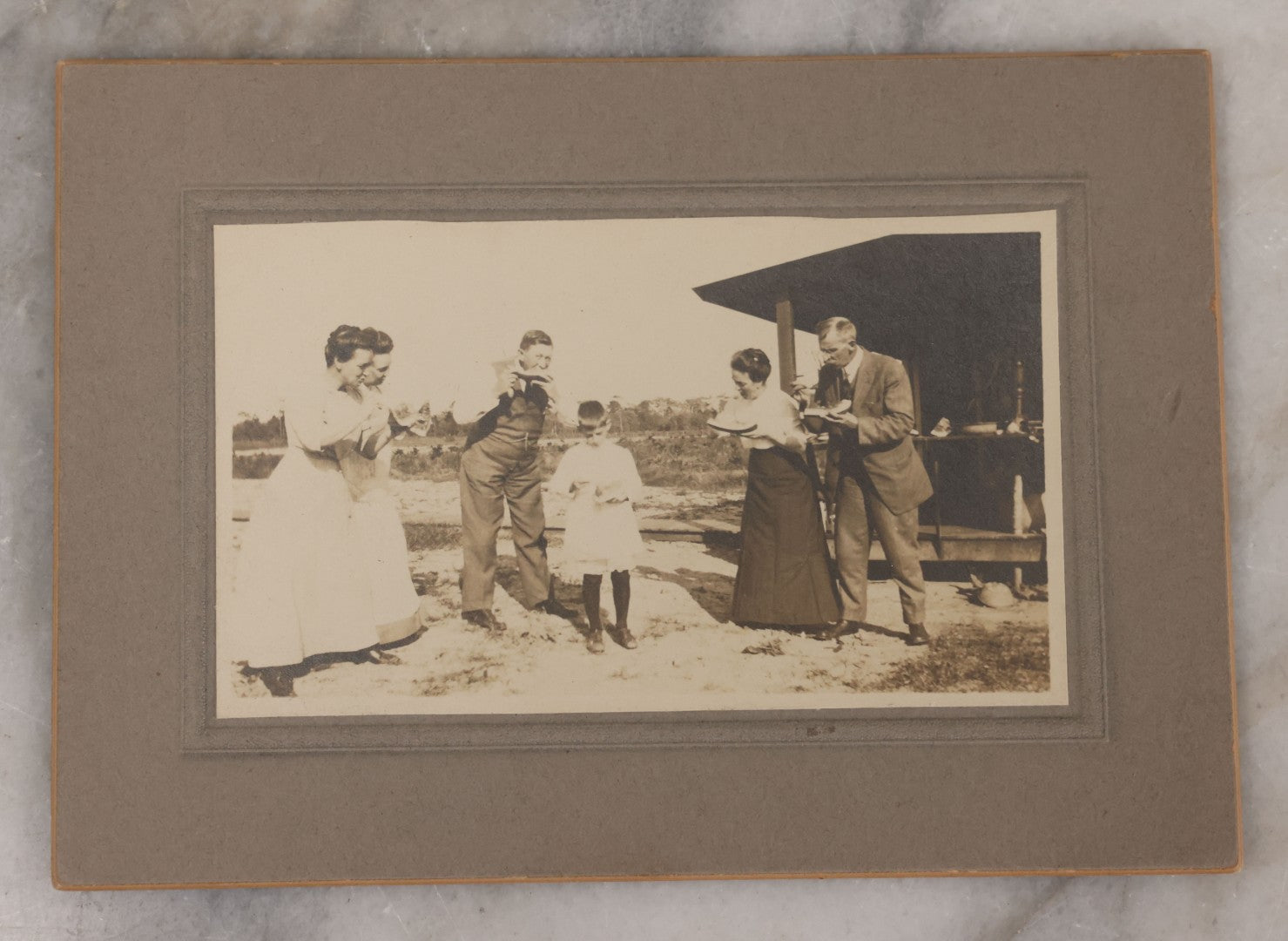 Lot 092 - Antique Boarded Photograph Of Group Of Five People Enjoying Juicy Watermelon In The Summer