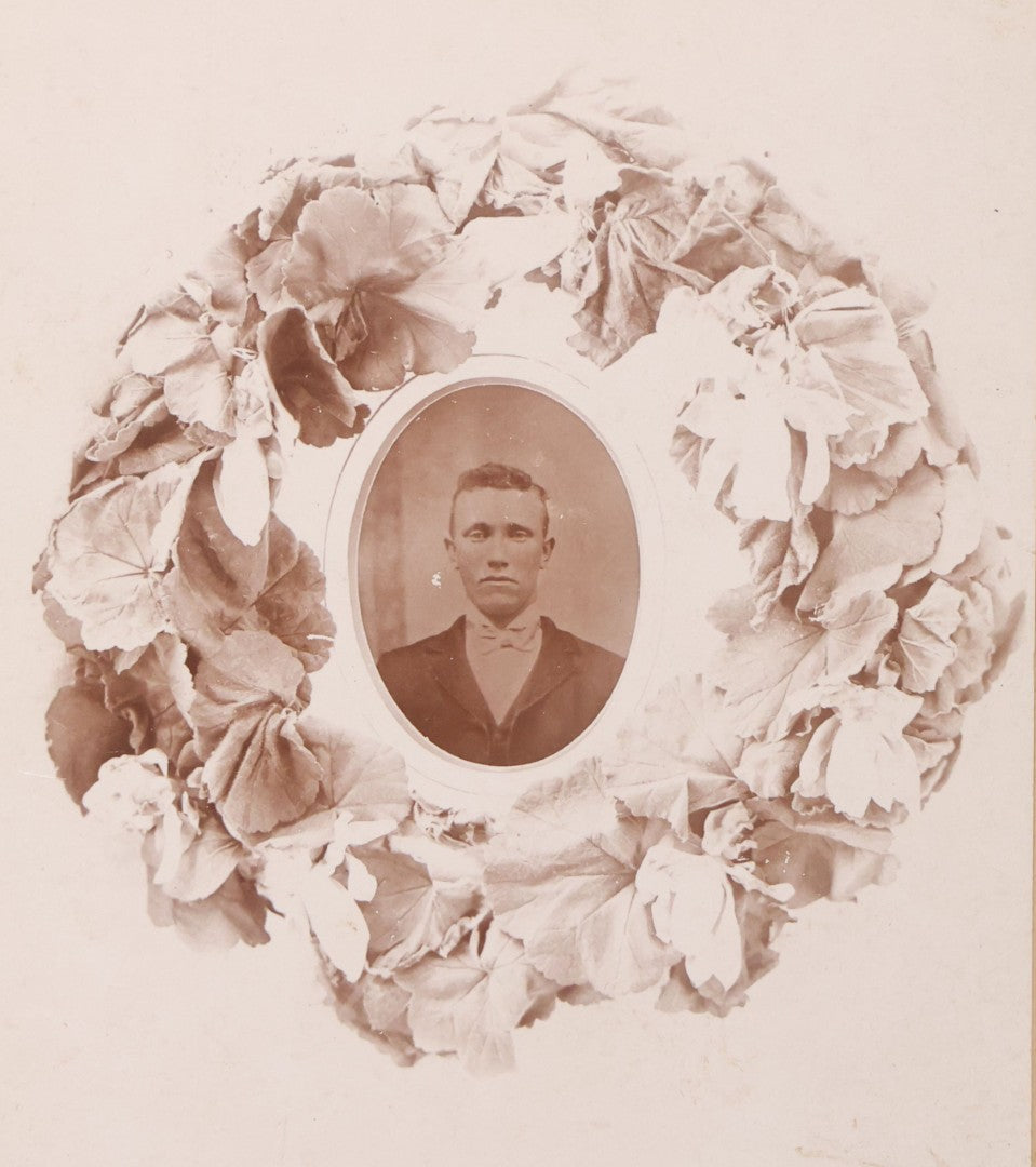 Lot 099 - Antique Cabinet Card Photograph Copy Of Tintype Of Man With Floral Wreath Surround, Likely A Remembrance Photograph