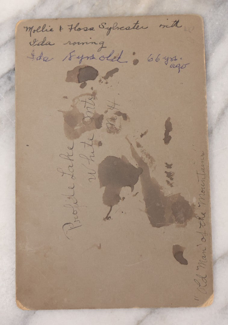 Lot 105 - Antique Cabinet Card Photograph Of Three Women Identified As Molly Sylvester And Sister With Ida, Rowing In Profile Lake With The Old Man Of The Mountain In Background, White Mountains, New Hampshire