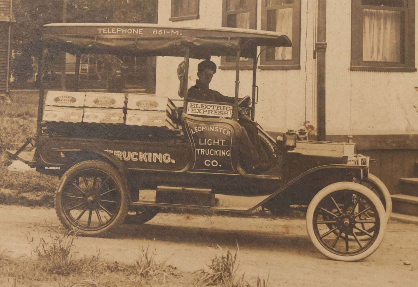Lot 108 - Antique Boarded Occupational Photograph Of Man Driving An Early Automobile Delivery Truck For Leominster Light Trucking Co., Electric Express