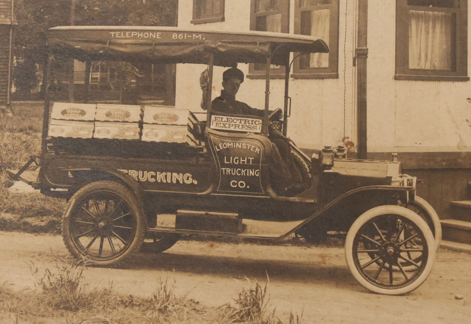 Lot 108 - Antique Boarded Occupational Photograph Of Man Driving An Early Automobile Delivery Truck For Leominster Light Trucking Co., Electric Express