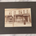 Lot 109 - Antique Boarded Occupational Photograph Of Proprietress Of H.L. Upham Domestic Bakery And Express Office Posing Outside Shop, Sturbridge, Massachusetts