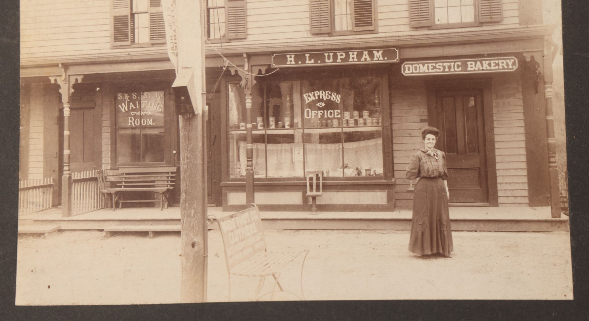 Lot 109 - Antique Boarded Occupational Photograph Of Proprietress Of H.L. Upham Domestic Bakery And Express Office Posing Outside Shop, Sturbridge, Massachusetts
