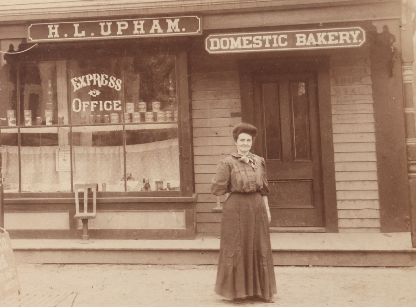 Lot 109 - Antique Boarded Occupational Photograph Of Proprietress Of H.L. Upham Domestic Bakery And Express Office Posing Outside Shop, Sturbridge, Massachusetts