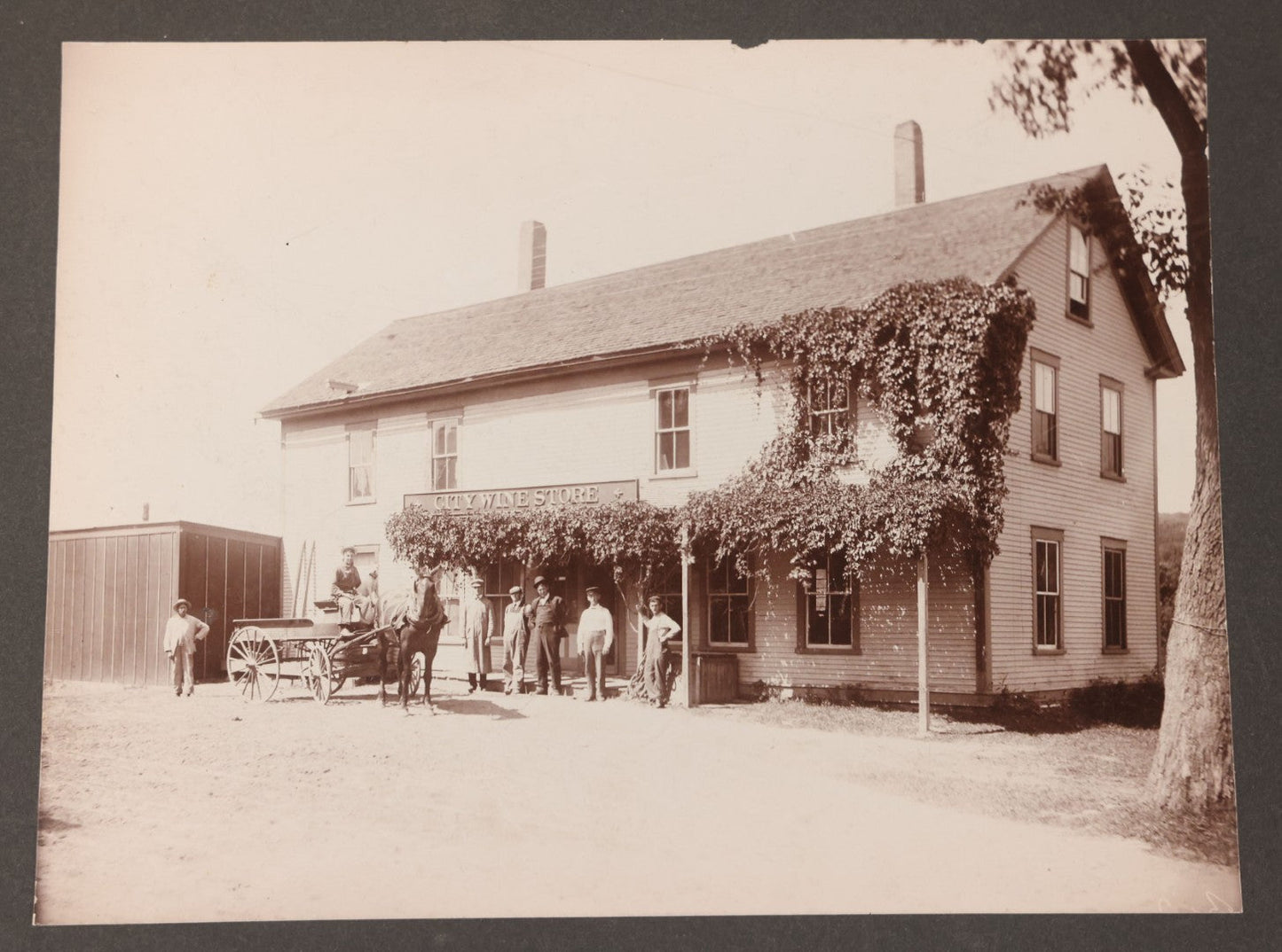 Lot 110 - Antique Boarded Occupational Photograph Of Merchants And Delivery Driver Posing Outside Of "City Wine Store," Likely From Western Massachusetts