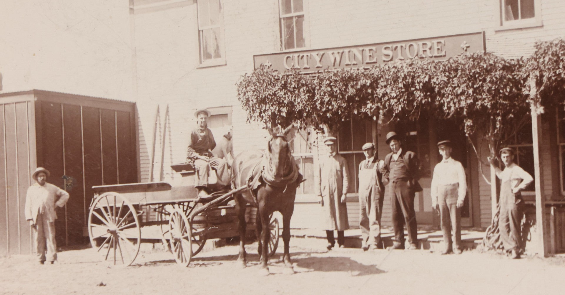 Lot 110 - Antique Boarded Occupational Photograph Of Merchants And Delivery Driver Posing Outside Of "City Wine Store," Likely From Western Massachusetts
