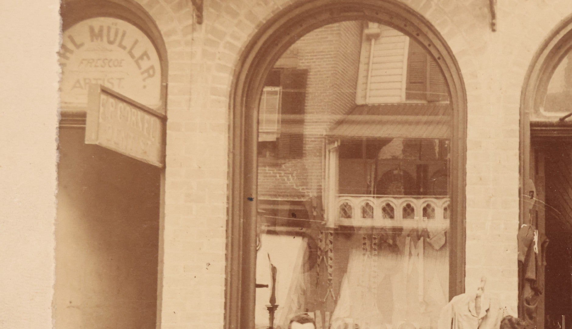 Lot 111 - Antique Boarded Occupational Photograph Of Workers And Dressmakers Posing Outside Their Shop, With Many Signs And Advertisements In Photo, Note Photo Has Large Crease Through Center On Verso