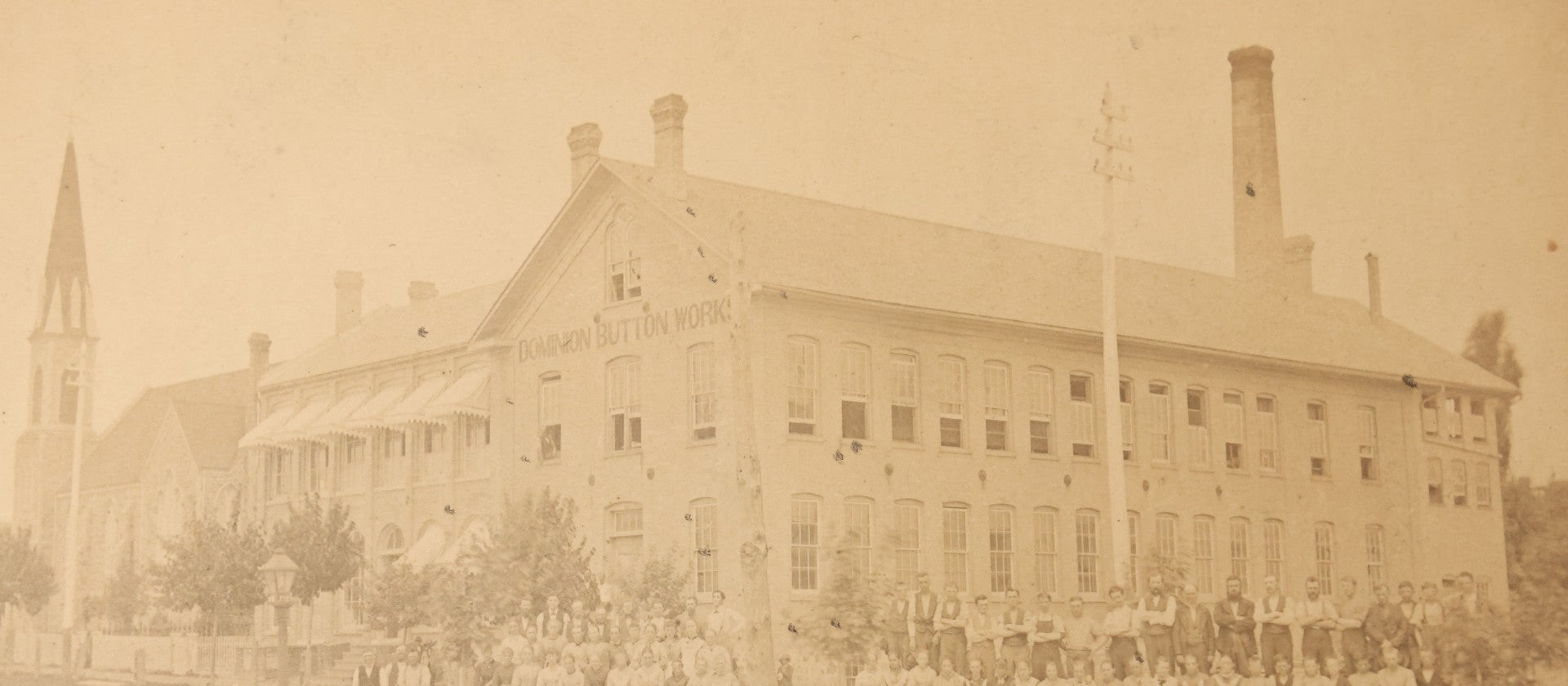 Lot 112 - Antique Boarded Occupational Photograph Of Large Group Of Workers Of The Dominion Button Works Factory, Ontario, Canada