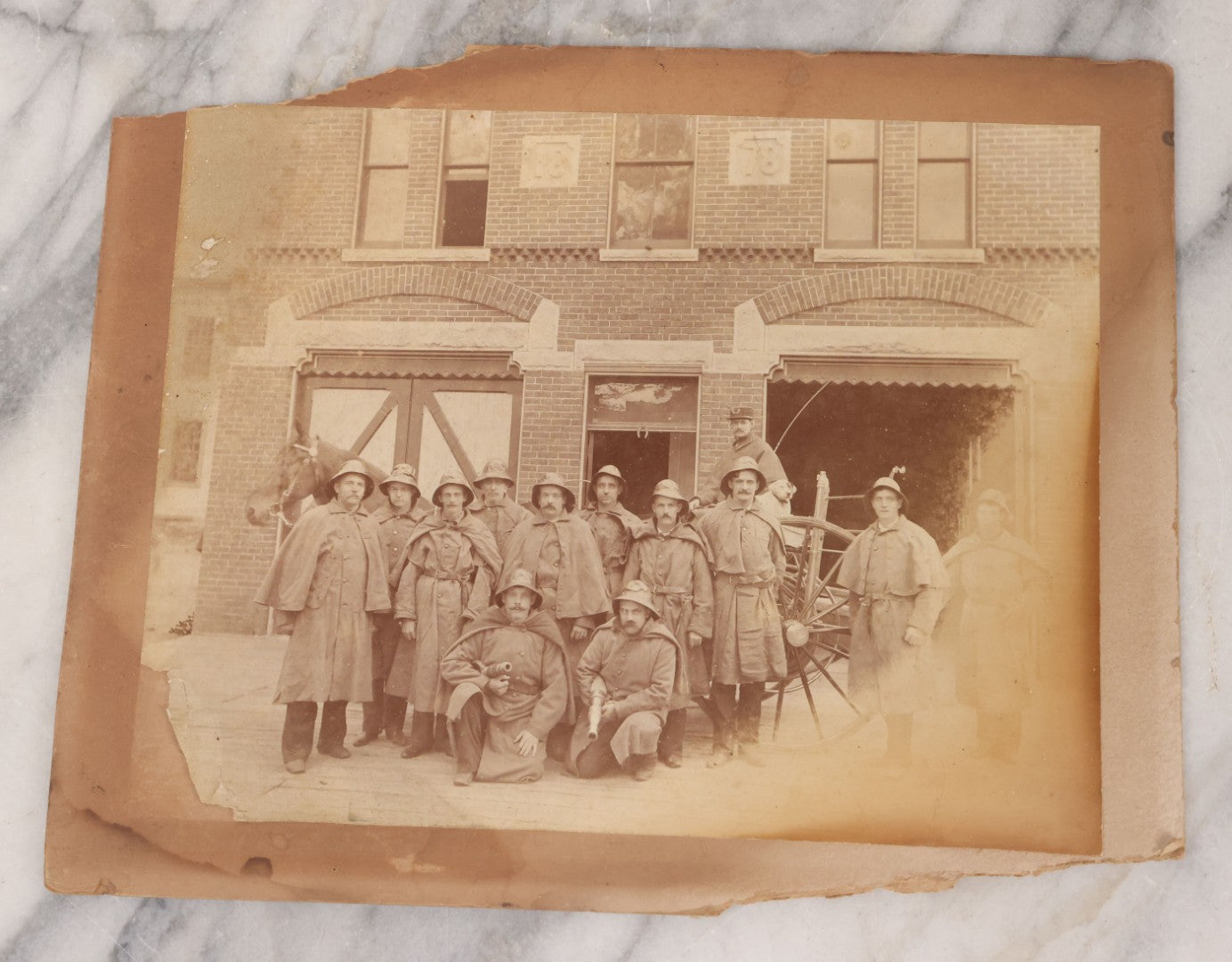 Lot 115 - Antique Boarded Occupational Photograph Of Group Of Late 19th Century Firefighters Posing With Their Horse Drawn Fire Engine And Their Firehouse Dog In Full Gear Outside Of Firehouse