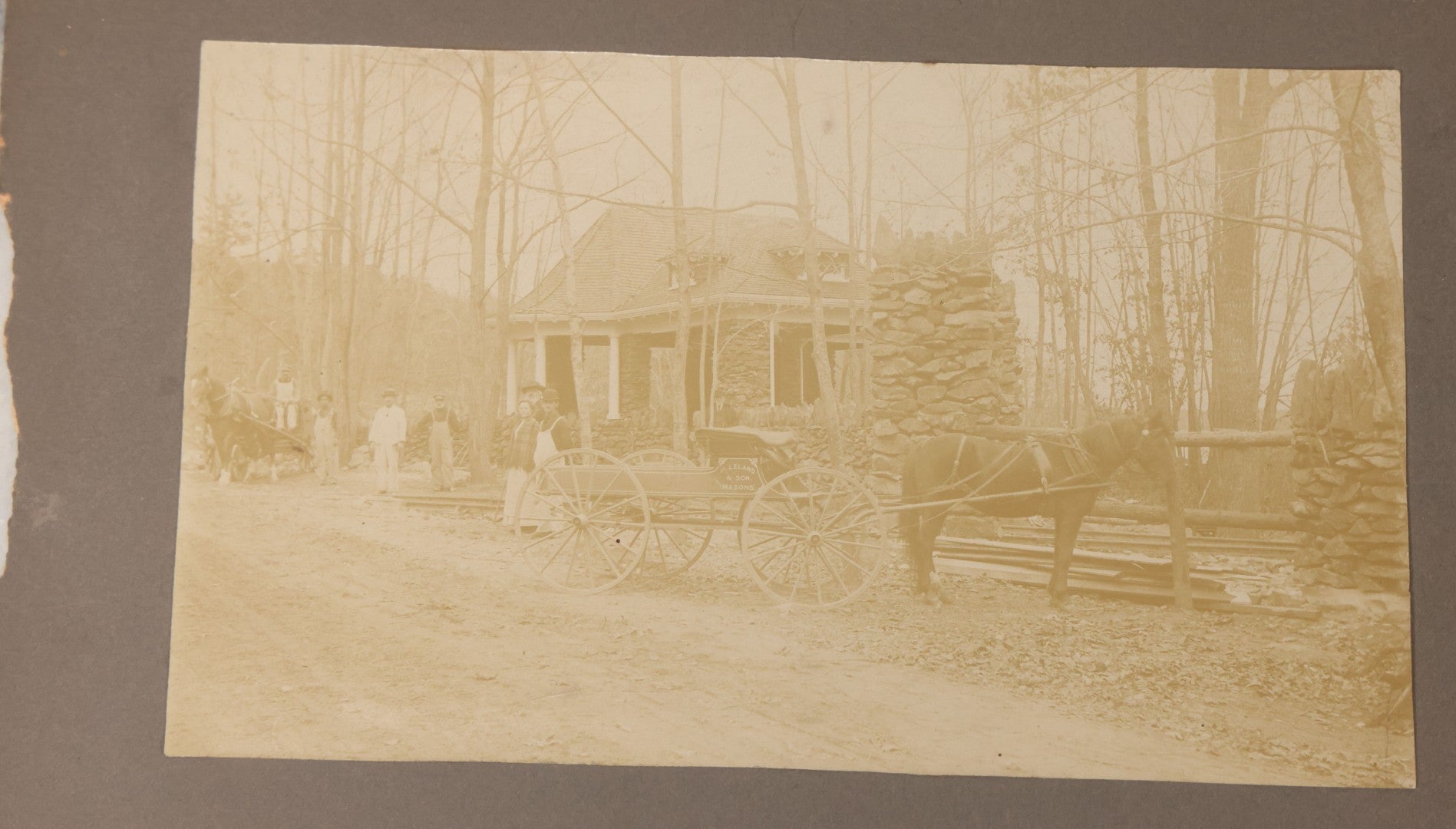 Lot 117 - Antique Boarded Occupational Photograph Of Travelers Waiting At The Trolley Station At The Entrance To Lake Nipmuc Park, Mendon, Massachusetts, Circa 1900, With Horse Drawn Wagon From Leland & Son Masons