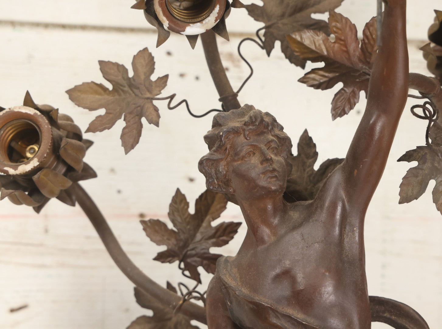 Lot 001 - Antique French Bronzed Spelter Art Nouveau Neo-Classical Revival Figural Lamp Base With Male Figure With Outstretched Arm Holding Torch And Three Curved Lighting Arms With Metal Leaves, Note Lamp Needs Complete Rewiring And Has Metal Damage