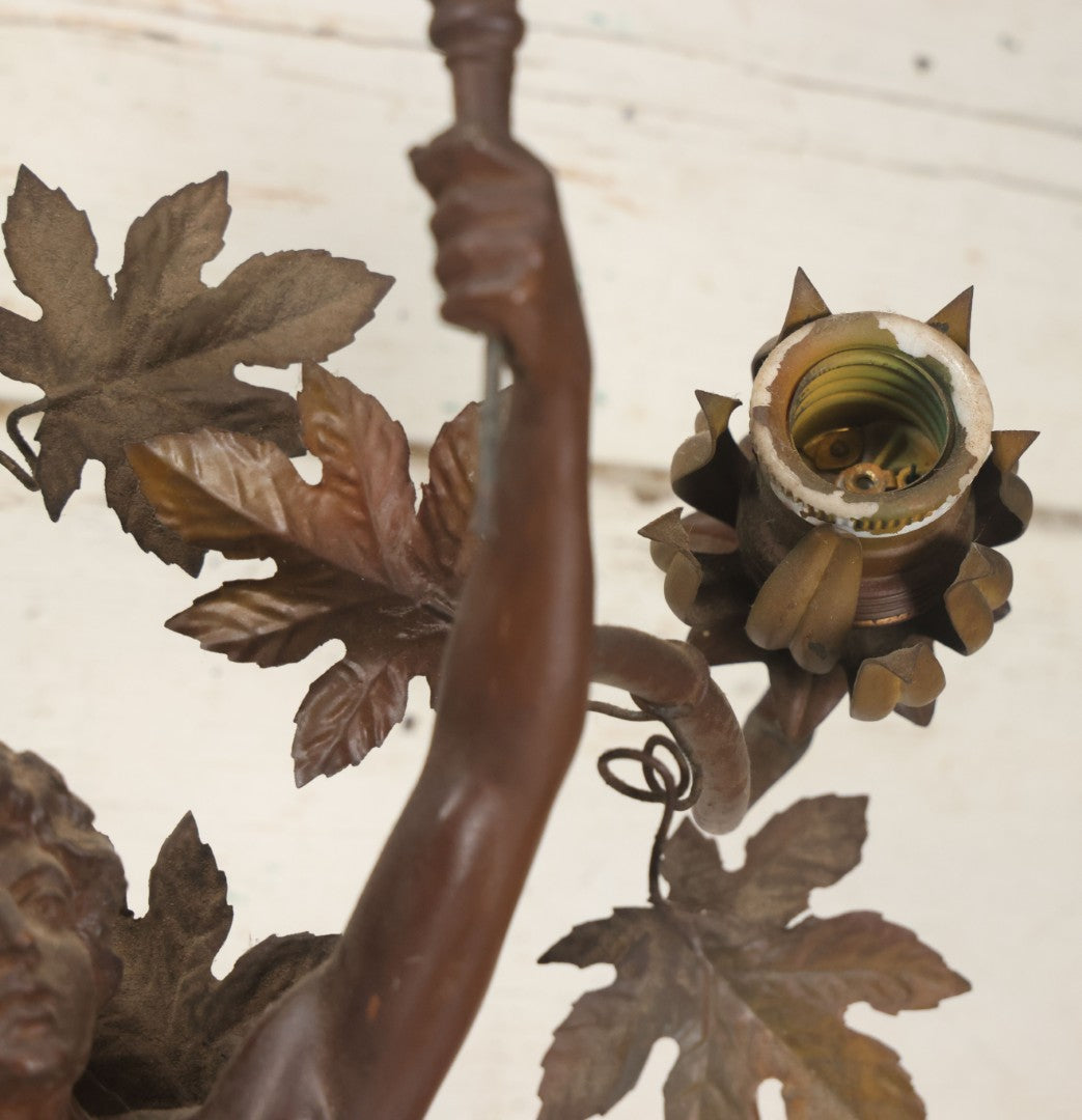 Lot 001 - Antique French Bronzed Spelter Art Nouveau Neo-Classical Revival Figural Lamp Base With Male Figure With Outstretched Arm Holding Torch And Three Curved Lighting Arms With Metal Leaves, Note Lamp Needs Complete Rewiring And Has Metal Damage