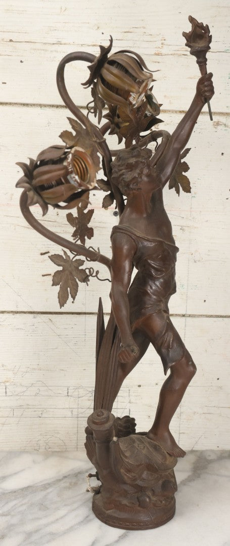 Lot 001 - Antique French Bronzed Spelter Art Nouveau Neo-Classical Revival Figural Lamp Base With Male Figure With Outstretched Arm Holding Torch And Three Curved Lighting Arms With Metal Leaves, Note Lamp Needs Complete Rewiring And Has Metal Damage